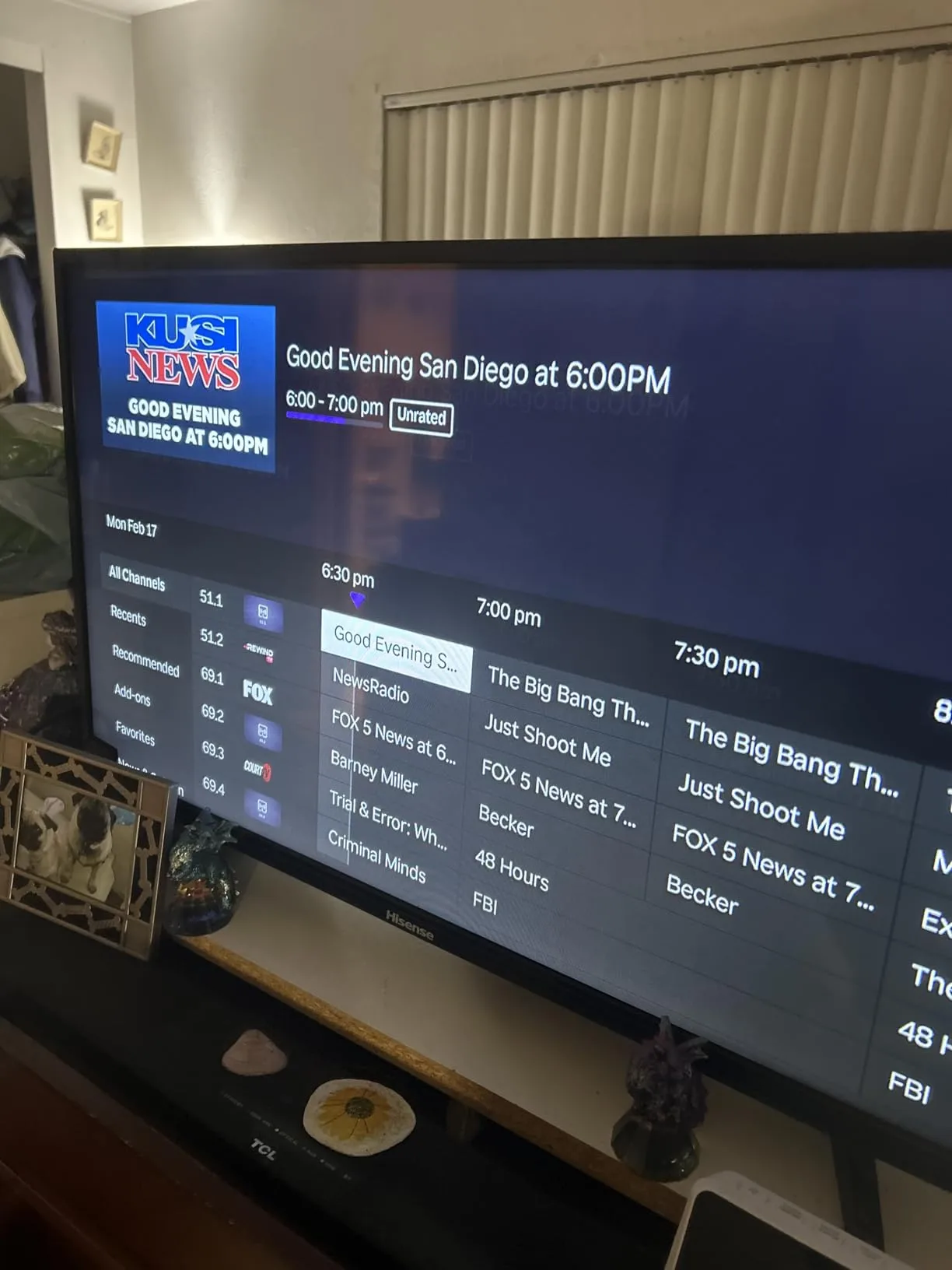 TV displaying channel guide with local news and programming